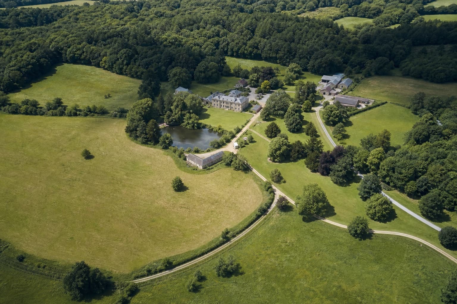 Rural estate, fields and woodland seen from the air